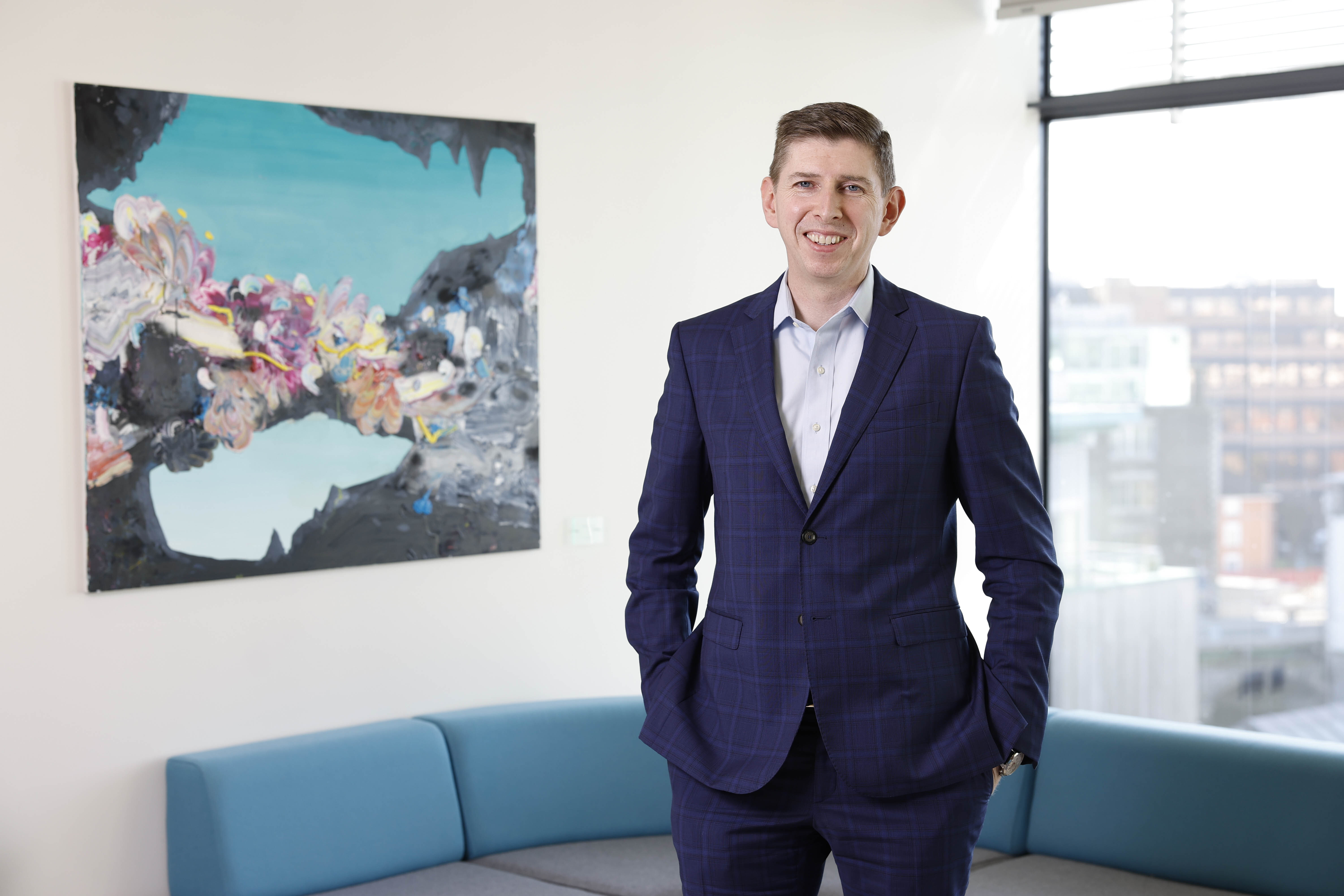 Smiling man in a dark blue suit